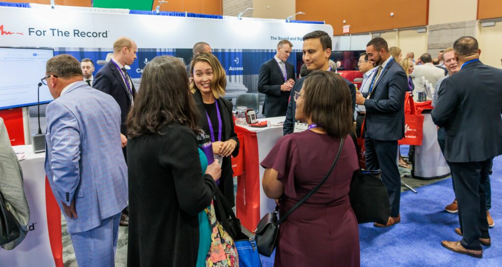 People in a tradeshow booth