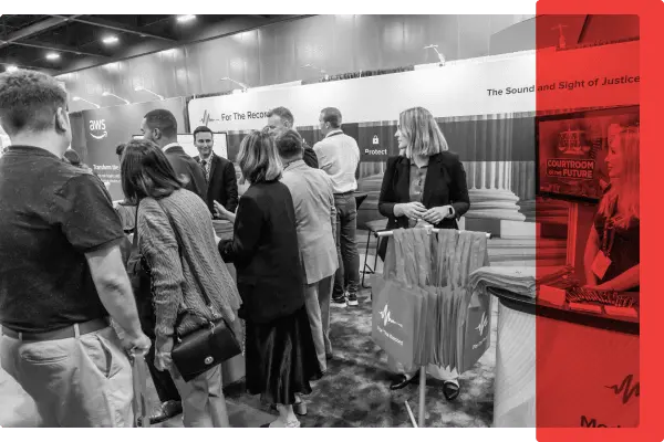 A group of people in a conference booth