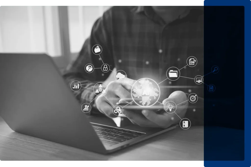 A man sitting at a laptop with AI icons floating